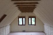 izolacja dachu domu drewnianego pianką 